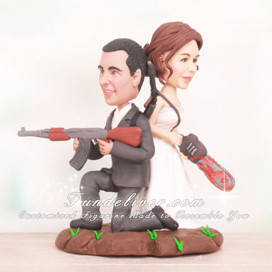 Bride and Groom Holding Weapons Zombies Fighting Cake Toppers - Click Image to Close