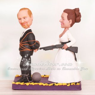 Bride Pushing Groom to the Alter with Shoot Gun Wedding Cake Toppers