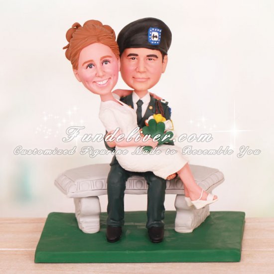 Groom Holding Bride Sitting on Bench Cake Toppers - Click Image to Close