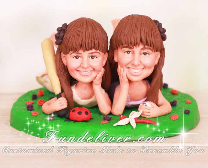 Cute Girls Lying on Grass Cake Toppers - Click Image to Close