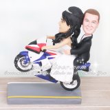 Biker Wedding Cake Toppers with Bride Giving the Groom a Ride