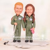 Couple in USAF Flight Suits Standing on Aircraft Cake Toppers