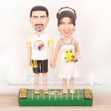 Bride and Groom Standing on Football Field Cake Toppers