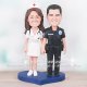Cop and Nurse Cake Topper with Blue Heart Base Cop and Nurse Cake Topper with Blue Heart Base