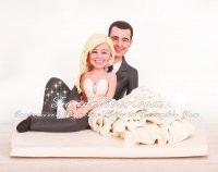 Bride Lying Together With Groom Wedding Cake Toppers