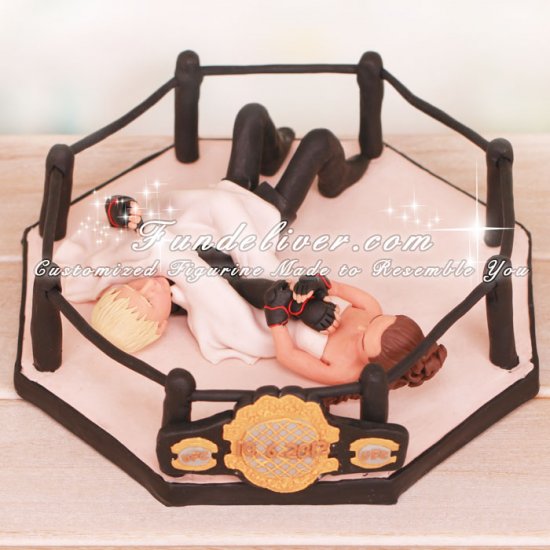 Bride Putting Groom Into an Arm Bar Cake Toppers - Click Image to Close
