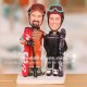 Couple Dressed Up in Ski Jackets and Ski Helmets Cake Toppers