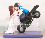 Groom Doing Stoppie Kissing Bride Cake Toppers