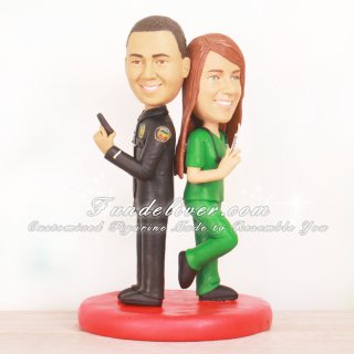 Dueling Cake Toppers with Bride Holding Syringe and Groom Holding Handgun